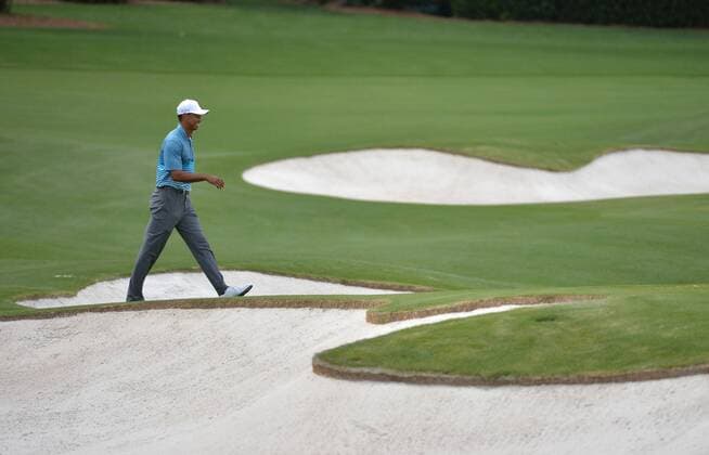 Tiger Woods walks on the practice range during a practice round prior to the 2015 Masters Tournament at Augusta, National in Augusta, Georgia on April 6, 2015.  AUG20150406327 KEVINxDIETSCH