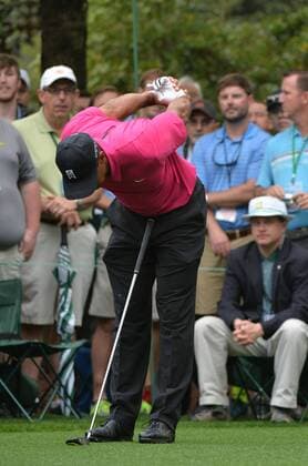 Tiger Woods stretches before hitting on the 7th tee box during a practice round prior to the 2015 Masters Tournament at Augusta, National in Augusta, Georgia on April 7, 2015.  AUG20150407302 KEVINxDIETSCH