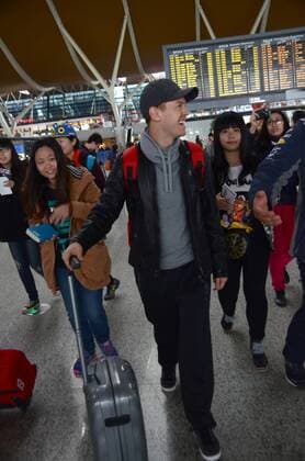 German F1 driver Sebastian Vettel of Ferrari, center, smiles after arriving at the Shanghai Pudong International Airport in Shanghai, China, 8 April 2015. Sebastian Vettel receives warm welcome in Shanghai  pbu255937_29