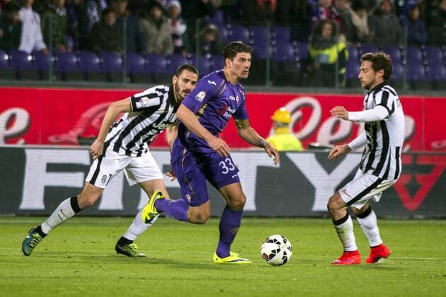 (L-R) Leonardo Bonucci (Juventus), Mario Gomez (Fiorentina), Claudio Marchisio (Juventus), APRIL 7, 2015 - Football Soccer : Coppa Italia (Tim Cup) Semi-final 2nd leg match between Fiorentina 0-3 Juventus at Artemio Franchi Stadium in Firenze, Italy. Noxthirdxpartyxsales  (ptmb073151)