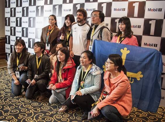 Spanish F1 driver Fernando Alonso of McLaren Honda, back center, poses with fans at a fan meeting event in Shanghai, China, 8 April 2015. Fernando Alonso heats up fan meeting event in Shanghai  pbu256095_03