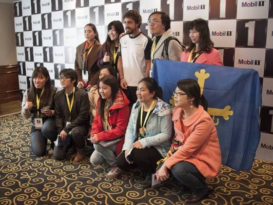 Spanish F1 driver Fernando Alonso of McLaren Honda, back center, poses with fans at a fan meeting event in Shanghai, China, 8 April 2015. Fernando Alonso heats up fan meeting event in Shanghai  pbu256095_04