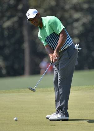 Tiger Woods putts on the 18th green during a practice round at the 2015 Masters Tournament at Augusta, National in Augusta, Georgia on April 8, 2015.  AUG20150408326 KEVINxDIETSCH