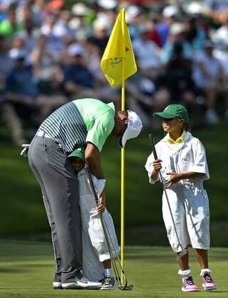 April 8, 2015 - Augusta, Georgia, U.S. - Golfer TIGER WOODS, left, hugs his son CHARLIE, center, as daughter SAM, right, looks on following a putt on the ninth green during the Par 3 contest on Wednesday at Augusta National Golf Club. Golf 2015 - The Masters - Practice Round - ZUMAm67_