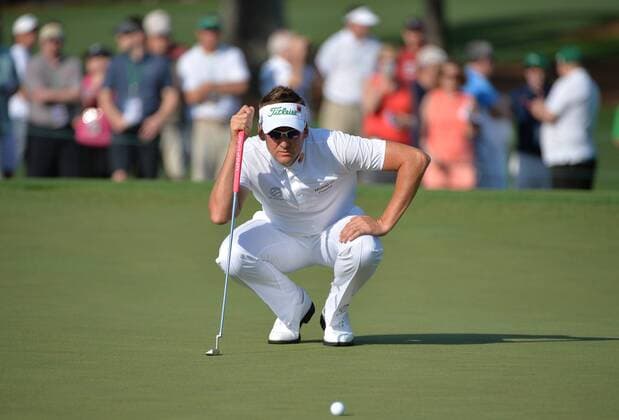 Ian Poulter from England lines up a putt on the second green in the first round of the 2015 Masters Tournament at Augusta National Golf Club in Augusta, Georgia on April 9, 2015.  MAS20150409137 KEVINxDIETSCH
