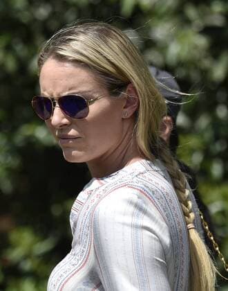 Lindsey Vonn follows Tiger Woods on the 4th hole in the first round the 2015 Masters Tournament at Augusta National Golf Club in Augusta, Georgia on April 9, 2015.  MAS20150409184 KEVINxDIETSCH