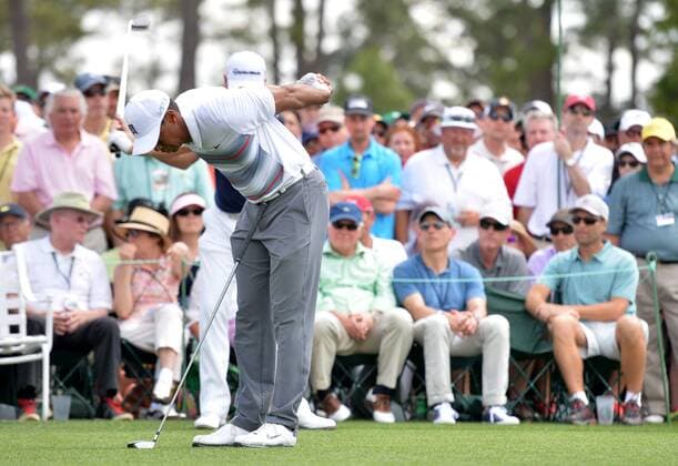 Tiger Woods stretches on the first tee box in the first round the 2015 Masters Tournament at Augusta National Golf Club in Augusta, Georgia on April 9, 2015.  MAS20150409183 KEVINxDIETSCH