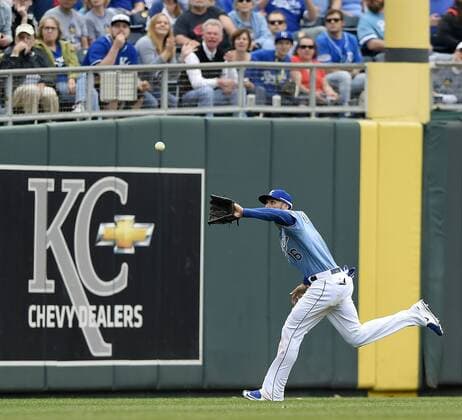 April 9, 2015 - Kansas City, MO, USA - Kansas City Royals left fielder Paulo Orlando (16) runs down a fly ball hit by Chicago White Sox s Conor Gillaspie to end the top of the seventh inning on Thursday, April 9, 2015, at Kauffman Stadium in Kansas City, Mo. Chicago White Sox at Kansas City Royals - ZUMAm67_