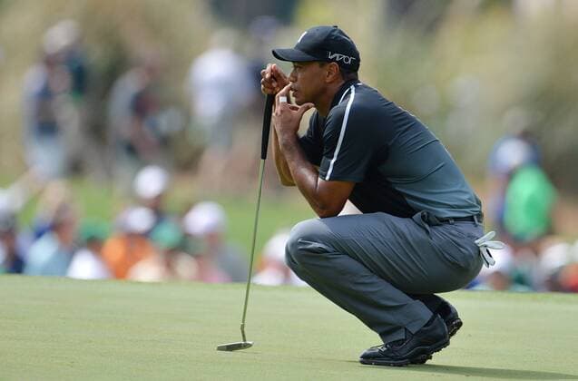 Tiger Woods lines up a putt on the 3rd hole in the second round of the 2015 Masters Tournament at Augusta National Golf Club in Augusta, Georgia on April 10, 2015.  AUG20150410136 KEVINxDIETSCH