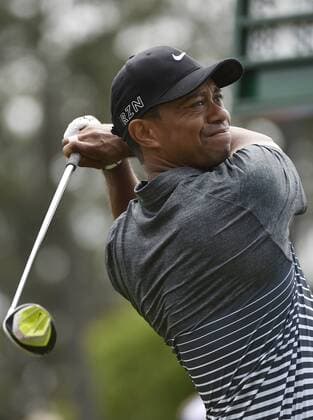 Tiger Woods tees off on the 1st hole in the third round of the 2015 Masters Tournament at Augusta National Golf Club in Augusta, Georgia on April 11, 2015.  AUG20150411104 KEVINxDIETSCH