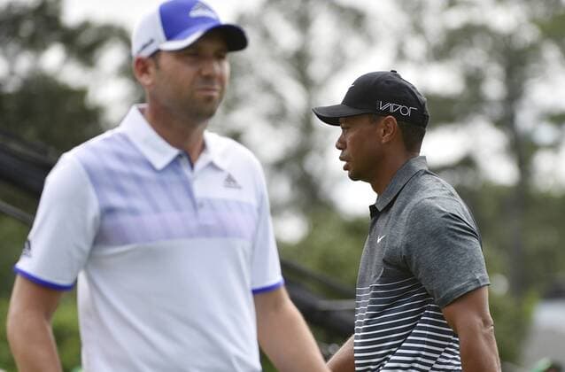Sergio Garcia of Spain and Tiger Woods stand on the first hole tee box in the third round of the 2015 Masters Tournament at Augusta National Golf Club in Augusta, Georgia on April 11, 2015.  AUG20150411102 KEVINxDIETSCH