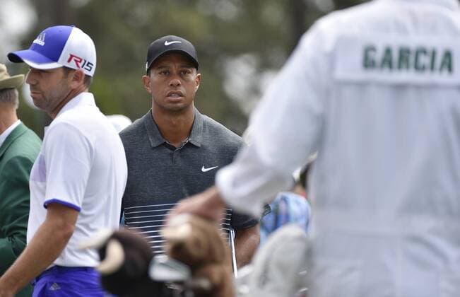 Sergio Garcia of Spain and Tiger Woods stand on the first hole tee box in the third round of the 2015 Masters Tournament at Augusta National Golf Club in Augusta, Georgia on April 11, 2015.  AUG20150411107 KEVINxDIETSCH