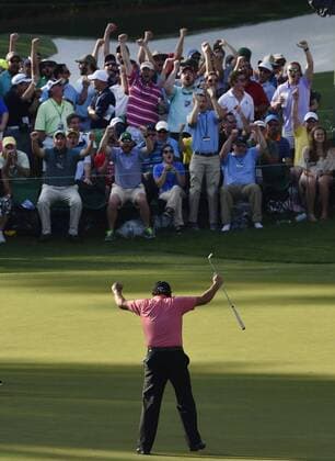 Patrons celebrate with Phil Mickelson after he makes a long putt for birdie on the 16th hole in the third round of the 2015 Masters Tournament at Augusta National Golf Club in Augusta, Georgia on April 11, 2015.  AUG20150411136 KEVINxDIETSCH