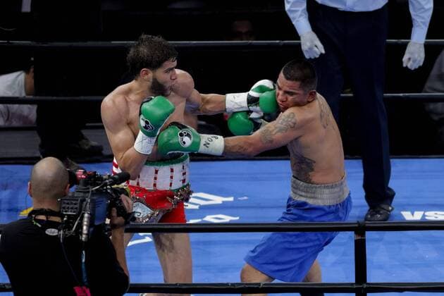 April 11, 2015 - Brooklyn, New York, USA - PRICHARD COLON and DANIEL CALZADA (blue trunks) battle in a junior middleweight bout at the Barclays Center in Brooklyn, New York. Boxing 2015 - Prichard Colon vs. Daniel Calzada - ZUMAp109