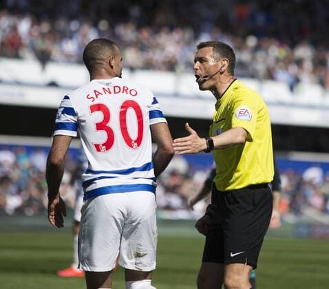 12.04.2015. London, England. Barclays Premier League. Queens Park Rangers QPR versus FC Chelsea. Referee Andre Marriner speaks to QPR s Sandro about a lunge he saw on Hazard earlier in play. xNigelxCookex  ActionPlus11612764