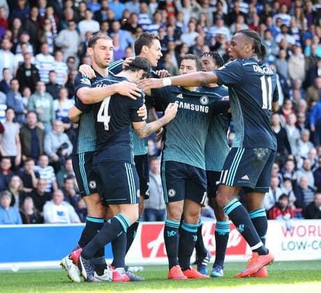 Chelsea s Cesc Fabregas celebrates scoring his sides opening goal as coins get thrown from the crowd Barclays Premier League- Queens Park Rangers vs Chelsea - Loftus Road - England - 12h April 2015 - Picture David Klein Sportimage EDITORIAL USE ONLY. No use with unauthorised audio, video, data, fixture lists, club league logos or live services. Online in-match use limited to 120 images, no video emulation. No use in betting, games or single club league player publications.