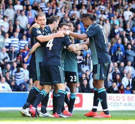 Chelsea s Cesc Fabregas celebrates scoring his sides opening goal as Branislav Ivanovic gets hit by a coin Barclays Premier League- Queens Park Rangers vs Chelsea - Loftus Road - England - 12h April 2015 - Picture David Klein Sportimage EDITORIAL USE ONLY. No use with unauthorised audio, video, data, fixture lists, club league logos or live services. Online in-match use limited to 120 images, no video emulation. No use in betting, games or single club league player publications.