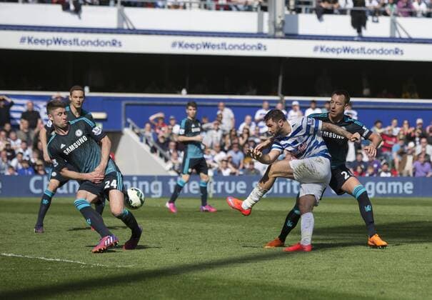 12.04.2015. London, England. Barclays Premier League. Queens Park Rangers versus Chelsea. QPR s Charlie Austin sees his shot blocked by Chelsea s Gary Cahill. xNigelxCookex  ActionPlus11612845