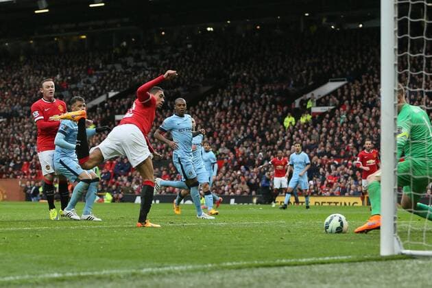 Chris Smalling of Manchester United ManU scores his sides fourth goal - Manchester United vs. Manchester City - Barclay s Premier League - Old Trafford - Manchester - 12 04 2015 Pic Philip Oldham Sportimage EDITORIAL USE ONLY. No use with unauthorised audio, video, data, fixture lists, club league logos or live services. Online in-match use limited to 120 images, no video emulation. No use in betting, games or single club league player publications.