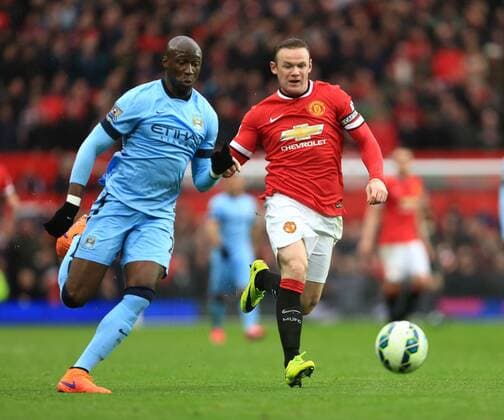 Eliaquim Mangala of Manchester City and Wayne Rooney of Manchester United ManU - Manchester United vs. Manchester City - Barclay s Premier League - Old Trafford - Manchester - 12 04 2015 Pic Philip Oldham Sportimage EDITORIAL USE ONLY. No use with unauthorised audio, video, data, fixture lists, club league logos or live services. Online in-match use limited to 120 images, no video emulation. No use in betting, games or single club league player publications.