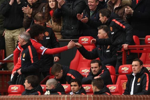 Louis Van Gaal, manager of Manchester United ManU congratulates Marouane Fellaini - Manchester United vs. Manchester City - Barclay s Premier League - Old Trafford - Manchester - 12 04 2015 Pic Philip Oldham Sportimage EDITORIAL USE ONLY. No use with unauthorised audio, video, data, fixture lists, club league logos or live services. Online in-match use limited to 120 images, no video emulation. No use in betting, games or single club league player publications.