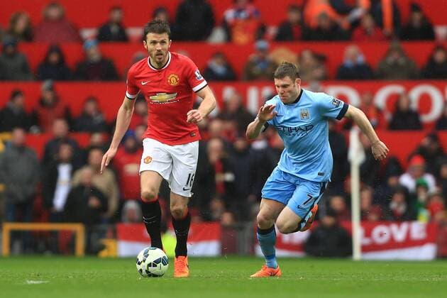 Michael Carrick of Manchester United ManU and James Milner of Manchester City - Manchester United vs. Manchester City - Barclay s Premier League - Old Trafford - Manchester - 12 04 2015 Pic Philip Oldham Sportimage EDITORIAL USE ONLY. No use with unauthorised audio, video, data, fixture lists, club league logos or live services. Online in-match use limited to 120 images, no video emulation. No use in betting, games or single club league player publications.