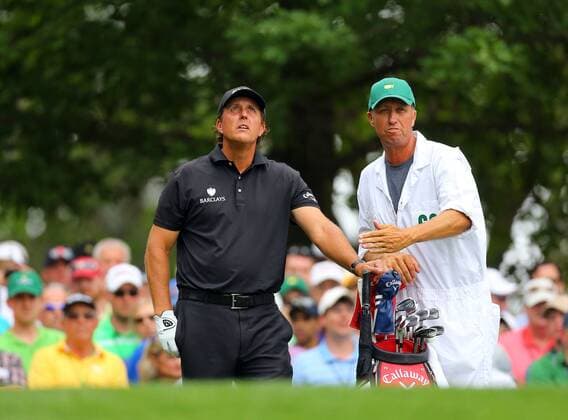 April 12, 2015 - Augusta, GA, USA - Phil Mickelson and his caddie, Jim Mackay, check the wind from the No. 4 tee during the final round of the Masters on Sunday, April 12, 2015, at Augusta National Golf Club in Augusta, Ga. Masters final round - ZUMAm67_