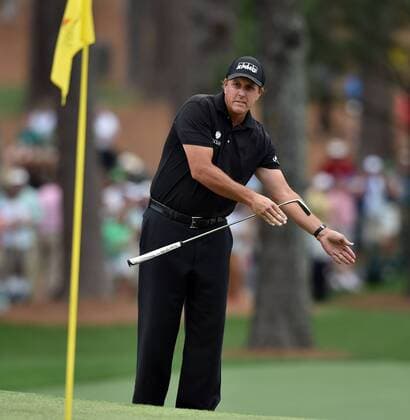 April 12, 2015 - Augusta, GA, USA - Phil Mickelson tries a little body english on his shot after chipping onto the seventh green during the final round of the Masters on Sunday, April 12, 2015, at Augusta National Golf Club in Augusta, Ga. Masters final round - ZUMAm67_