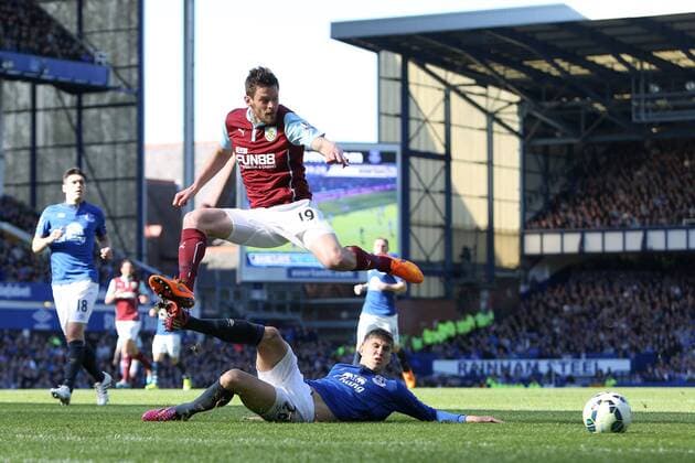 John Stones of Everton tackles Lukas Jutkiewicz of Burnley - Everton vs. Burnley - Barclay s Premier League - Goodison Park - Liverpool - 18 04 2015 Pic Philip Oldham Sportimage EDITORIAL USE ONLY. No use with unauthorised audio, video, data, fixture lists, club league logos or live services. Online in-match use limited to 120 images, no video emulation. No use in betting, games or single club league player publications.