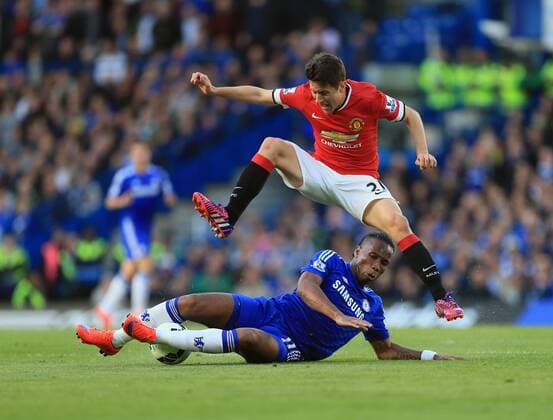 Chelsea s Didier Drogba tussles with Manchester United ManU s Ander Herrera Barclays Premier League- Chelsea vs Manchester United - Stamford Bridge - England - 18th April 2015 - Picture David Klein Sportimage EDITORIAL USE ONLY. No use with unauthorised audio, video, data, fixture lists, club league logos or live services. Online in-match use limited to 120 images, no video emulation. No use in betting, games or single club league player publications.
