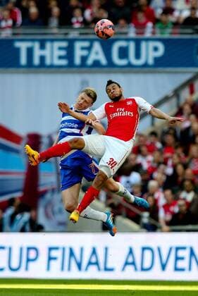 Francis Coquelin of Arsenal and Reading s Pavel Pogrebnyak - FA Cup Semi Final - Reading v Arsenal - Wembley Stadium - London - 18 04 2015 - Pic Charlie Forgham-Bailey Sportimage EDITORIAL USE ONLY. No use with unauthorised audio, video, data, fixture lists, club league logos or live services. Online in-match use limited to 120 images, no video emulation. No use in betting, games or single club league player publications.