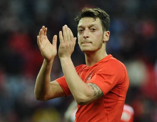 Football - 2014 2015 FA Cup - Semi-Final: Reading vs. Arsenal Arsenal s Mesut Ozil applauds the Arsenal fans after the match at Wembley. COLORSPORT ANDREW COWIE 