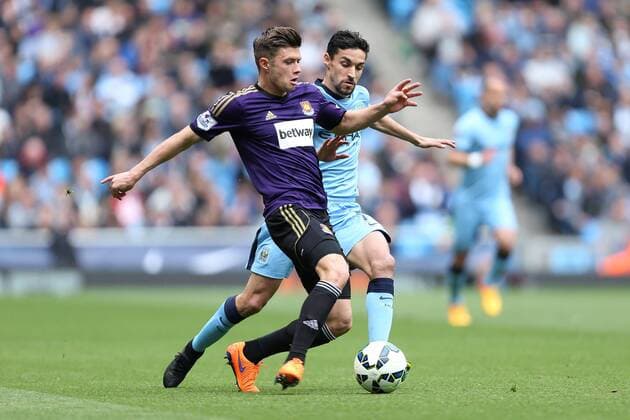 West Ham s Aaron Cresswell battles Jesus Navas of Manchester City - Manchester City vs. West Ham United - Barclay s Premier League - Etihad Stadium - Manchester - 19 04 2015 Pic Philip Oldham Sportimage EDITORIAL USE ONLY. No use with unauthorised audio, video, data, fixture lists, club league logos or live services. Online in-match use limited to 120 images, no video emulation. No use in betting, games or single club league player publications.