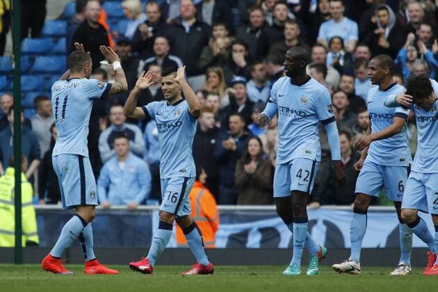 19.04.2015. Manchester, England. Barclays Premier League. Manchester City versus West Ham. Manchester City striker Sergio Ag& xfc;ero celebrates with his team mates after scoring his team s second goal. xAlanxMartinx  ActionPlus11614265