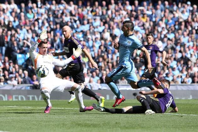 Sergio Aguero of Manchester City takes a tumble before receiving treatment - Manchester City vs. West Ham United - Barclay s Premier League - Etihad Stadium - Manchester - 19 04 2015 Pic Philip Oldham Sportimage EDITORIAL USE ONLY. No use with unauthorised audio, video, data, fixture lists, club league logos or live services. Online in-match use limited to 120 images, no video emulation. No use in betting, games or single club league player publications.