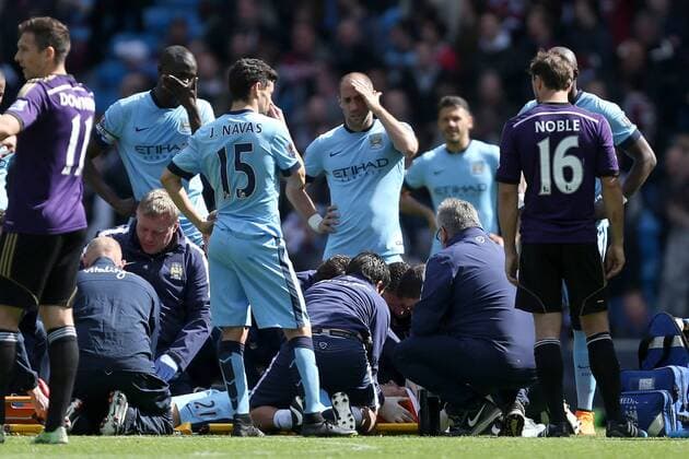 David Silva of Manchester City receives treatment as his team mates look worried - Manchester City vs. West Ham United - Barclay s Premier League - Etihad Stadium - Manchester - 19 04 2015 Pic Philip Oldham Sportimage EDITORIAL USE ONLY. No use with unauthorised audio, video, data, fixture lists, club league logos or live services. Online in-match use limited to 120 images, no video emulation. No use in betting, games or single club league player publications.