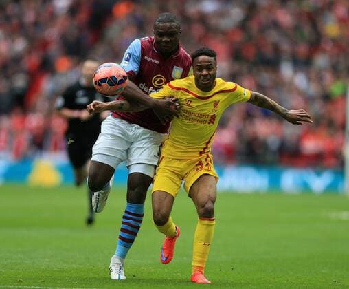 Aston Villa s Jores Okore tussles with Liverpool s Raheem Sterling The FA Cup - Semi Final- Aston Villa vs Liverpool - Wembley - England - 19th April 2015 - Picture David Klein Sportimage EDITORIAL USE ONLY. No use with unauthorised audio, video, data, fixture lists, club league logos or live services. Online in-match use limited to 120 images, no video emulation. No use in betting, games or single club league player publications.