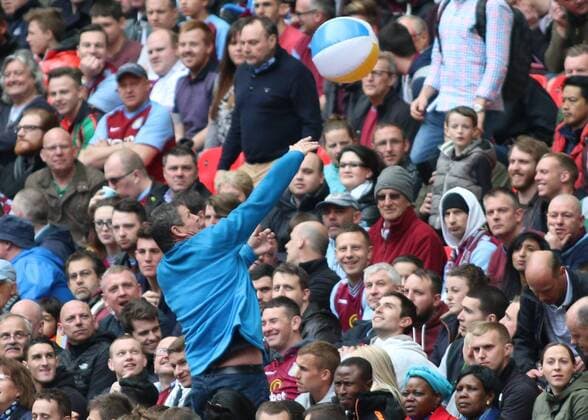 Football - 2014 2015 - FA Cup Semi Final, - Aston Villa Vs Liverpool, An Aston Villa celebrates taking the lead against Liverpool by passing a beach ball at Wembley Stadium COLORSPORT DANIEL BEARHAM  AST_LIV