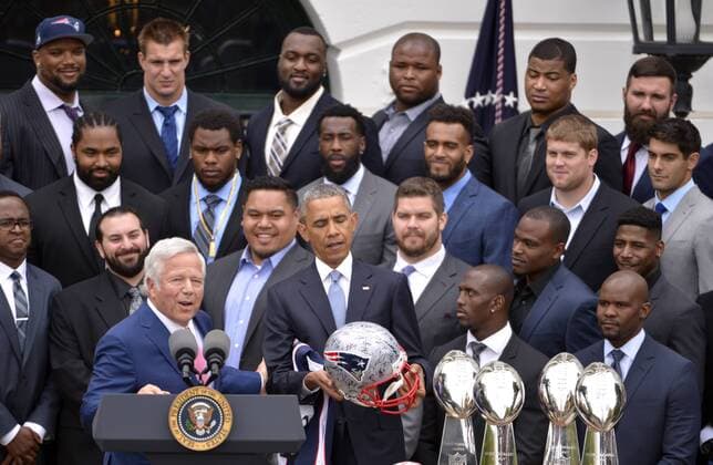 WUHAN, April 23, 2015 -- U.S. President Barack Obama (front R) looks at a helmet as New England Patriots owner Robert Kraft (front L) speaks at a ceremony honoring the Super Bowl Champion New England Patriots on the South Lawn of the White House in Washington D.C., the United States, April 23, 2015. ) (SP)U.S.-WASHINTON D.C.-FOOTBALL-NEW ENGLAND PATRIOTS YinxBogu 