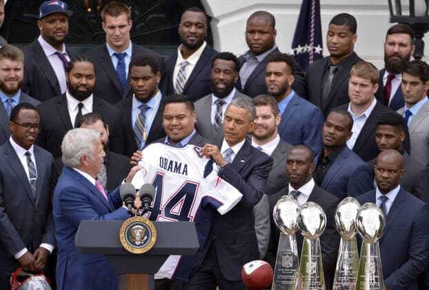 WUHAN, April 23, 2015 -- New England Patriots owner Robert Kraft (front R) presents a team jersey to U.S. President Barack Obama (front L) at a ceremony honoring the Super Bowl Champion New England Patriots on the South Lawn of the White House in Washington D.C., the United States, April 23, 2015. ) (SP)U.S.-WASHINTON D.C.-FOOTBALL-NEW ENGLAND PATRIOTS YinxBogu 