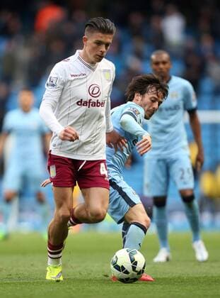 Jack Grealish of Aston Villa battles David Silva of Manchester City - Manchester City vs. Aston Villa - Barclay s Premier League - Etihad Stadium - Manchester - 25 04 2015 Pic Philip Oldham Sportimage EDITORIAL USE ONLY. No use with unauthorised audio, video, data, fixture lists, club league logos or live services. Online in-match use limited to 120 images, no video emulation. No use in betting, games or single club league player publications.