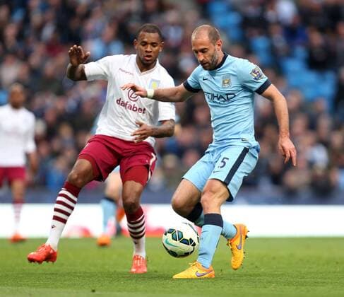 Leandro Bacuna of Aston Villa and Pablo Zabaleta of Manchester City in action - Manchester City vs. Aston Villa - Barclay s Premier League - Etihad Stadium - Manchester - 25 04 2015 Pic Philip Oldham Sportimage EDITORIAL USE ONLY. No use with unauthorised audio, video, data, fixture lists, club league logos or live services. Online in-match use limited to 120 images, no video emulation. No use in betting, games or single club league player publications.