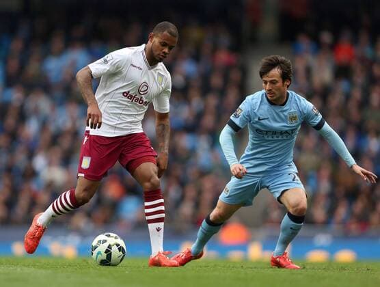 Leandro Bacuna of Aston Villa and David Silva of Manchester City - Manchester City vs. Aston Villa - Barclay s Premier League - Etihad Stadium - Manchester - 25 04 2015 Pic Philip Oldham Sportimage EDITORIAL USE ONLY. No use with unauthorised audio, video, data, fixture lists, club league logos or live services. Online in-match use limited to 120 images, no video emulation. No use in betting, games or single club league player publications.