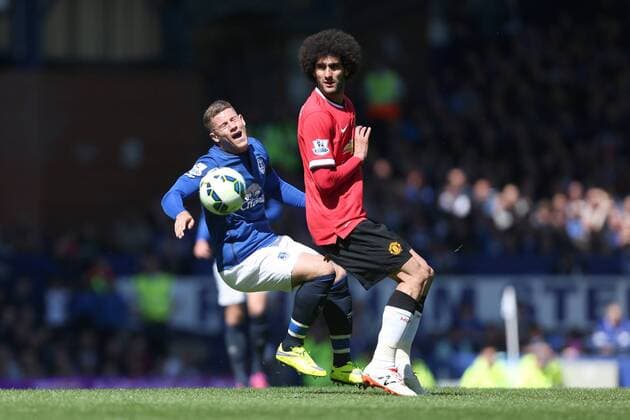 Marouane Fellaini of Manchester United ManU earns a yellow card for his foul on Ross Barkley of Everton - Everton vs. Manchester United - Barclay s Premier League - Goodison Park - Liverpool- 26 04 2015 Pic Philip Oldham Sportimage EDITORIAL USE ONLY. No use with unauthorised audio, video, data, fixture lists, club league logos or live services. Online in-match use limited to 120 images, no video emulation. No use in betting, games or single club league player publications.