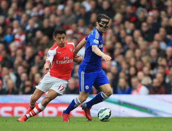 Arsenal s Alexis Sanchez tussles with Chelsea s Cesc Fabregas Barclays Premier League - Arsenal vs Chelsea - Emirates Stadium - England - 26th April 2015 - Picture David Klein Sportimage EDITORIAL USE ONLY. No use with unauthorised audio, video, data, fixture lists, club league logos or live services. Online in-match use limited to 120 images, no video emulation. No use in betting, games or single club league player publications.