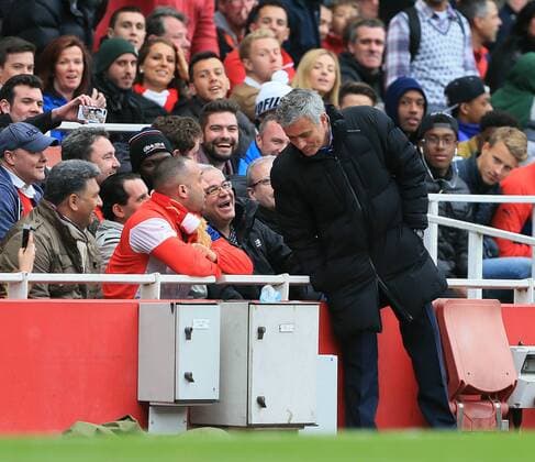 Chelsea s Jose Mourinho chats to Arsenal fans during the match Barclays Premier League - Arsenal vs Chelsea - Emirates Stadium - England - 26th April 2015 - Picture David Klein Sportimage EDITORIAL USE ONLY. No use with unauthorised audio, video, data, fixture lists, club league logos or live services. Online in-match use limited to 120 images, no video emulation. No use in betting, games or single club league player publications.