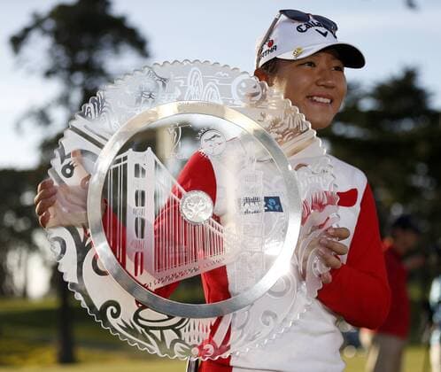April 26, 2015 - Daly City, CA, USA - Lydia Ko poses with the trophy on the 18th hole after winning the final round of the Swinging Skirts LPGA Golf Damen Classic on the second playoff hole on Sunday, April 26, 2015, at Lake Merced Golf Club in Daly City, Calif. Swinging Skirts LPGA Classic - ZUMAm67_