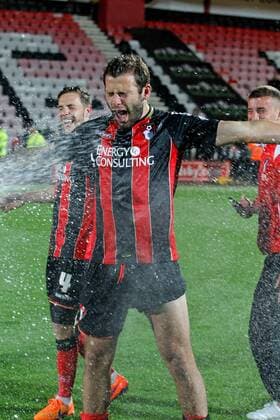 Football - 2014 2015 Sky Bet Championship - AFC Bournemouth Bournemouth s Steve Cook gets sprayed with champagne after a home win gives Bournemouth promotion to the premier league 