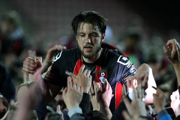 Football - 2014 2015 Sky Bet Championship - AFC Bournemouth Bournemouth s Harry Arter gets lifted by the crowd at the final whistle as Bournemouth get promoted to the premier leage at The Goldsands Stadium 