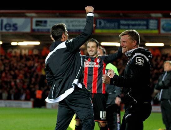 Football - 2014 2015 Sky Bet Championship - AFC Bournemouth Bournemouth s Manager Eddie Howe, Bournemouth s Assistant Manager Jason Tindall and Brett Pitman celebrate Bournemouth s third goal to clinch promotion to the premier league at The Goldsands Stadium 